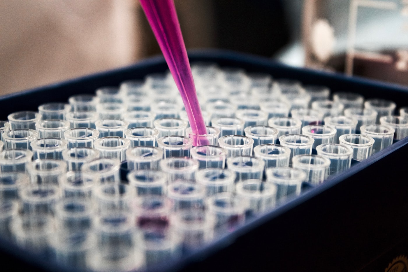 Laboratory scientist pipetting samples in a pharmaceutical research setting