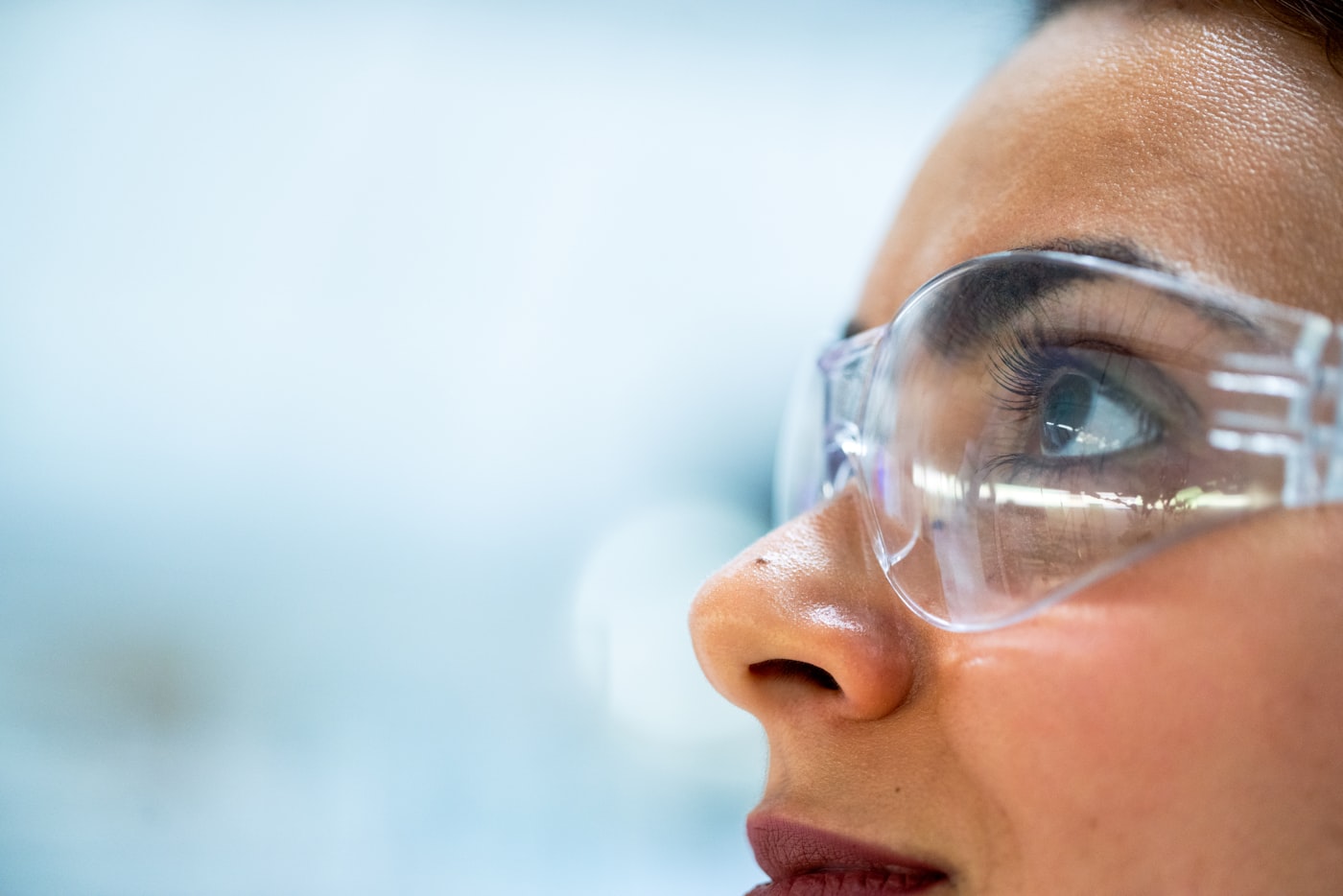 Scientist wearing safety goggles in a quality laboratory